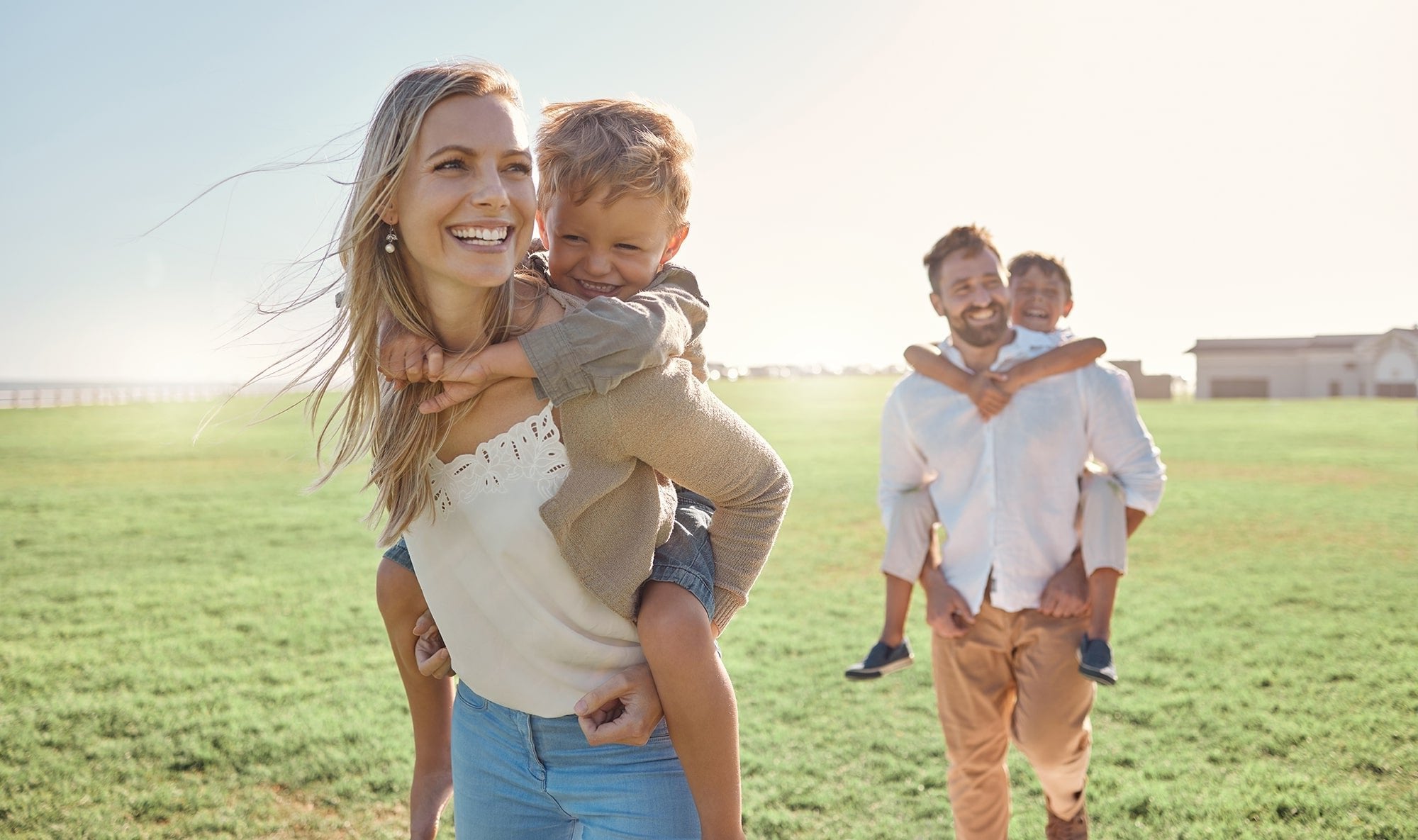 Family parents and children piggyback